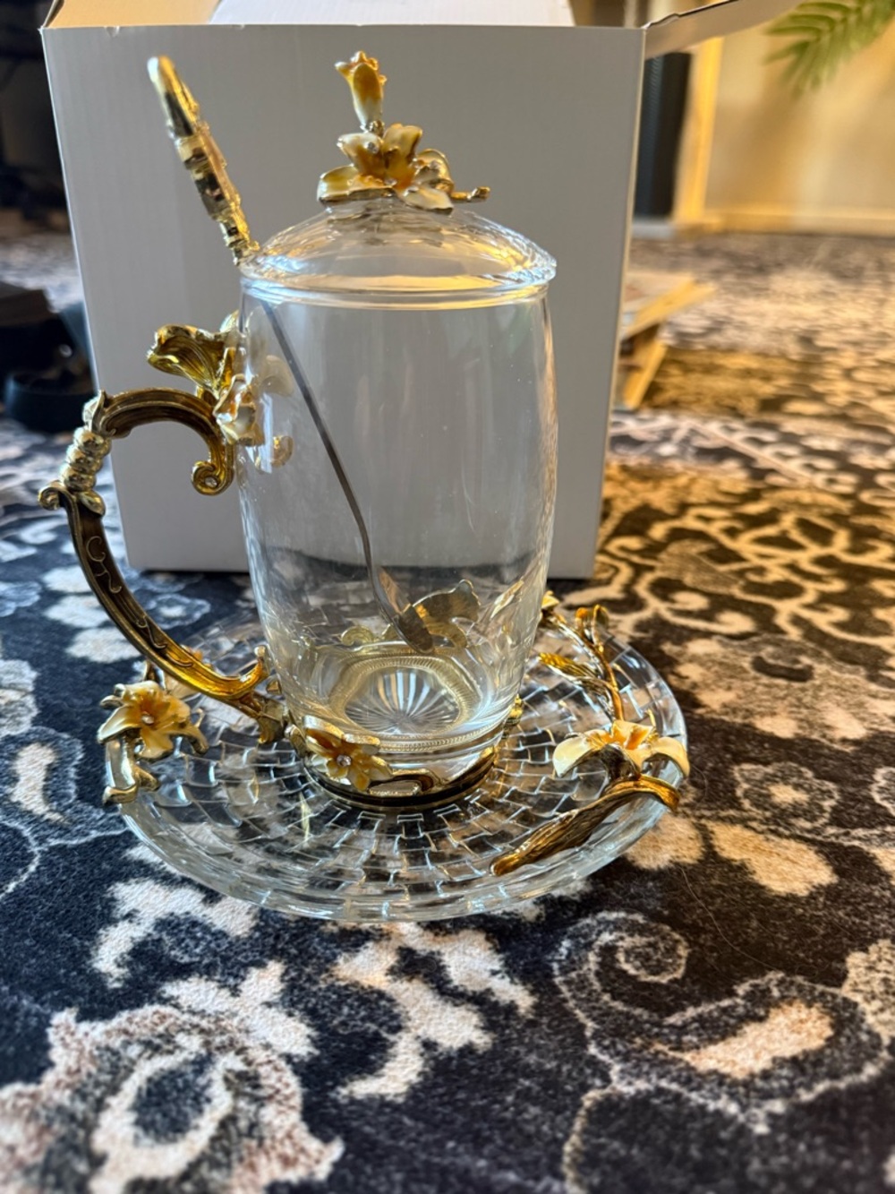 Ornate Glass Tea Cup with Gold Flower Accents